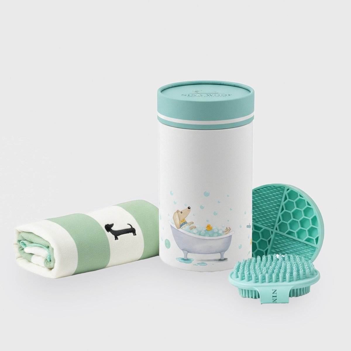 Dog bath kit with a silicone brush, towel, and lick mat